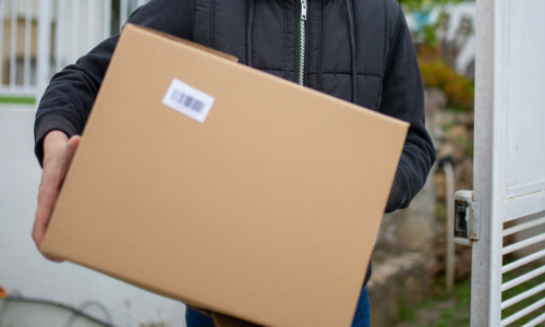 A cardboard box being carried