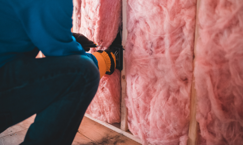 Pink insulation being installed.