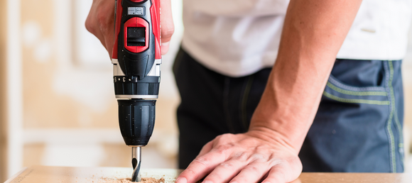 A power drill being used.